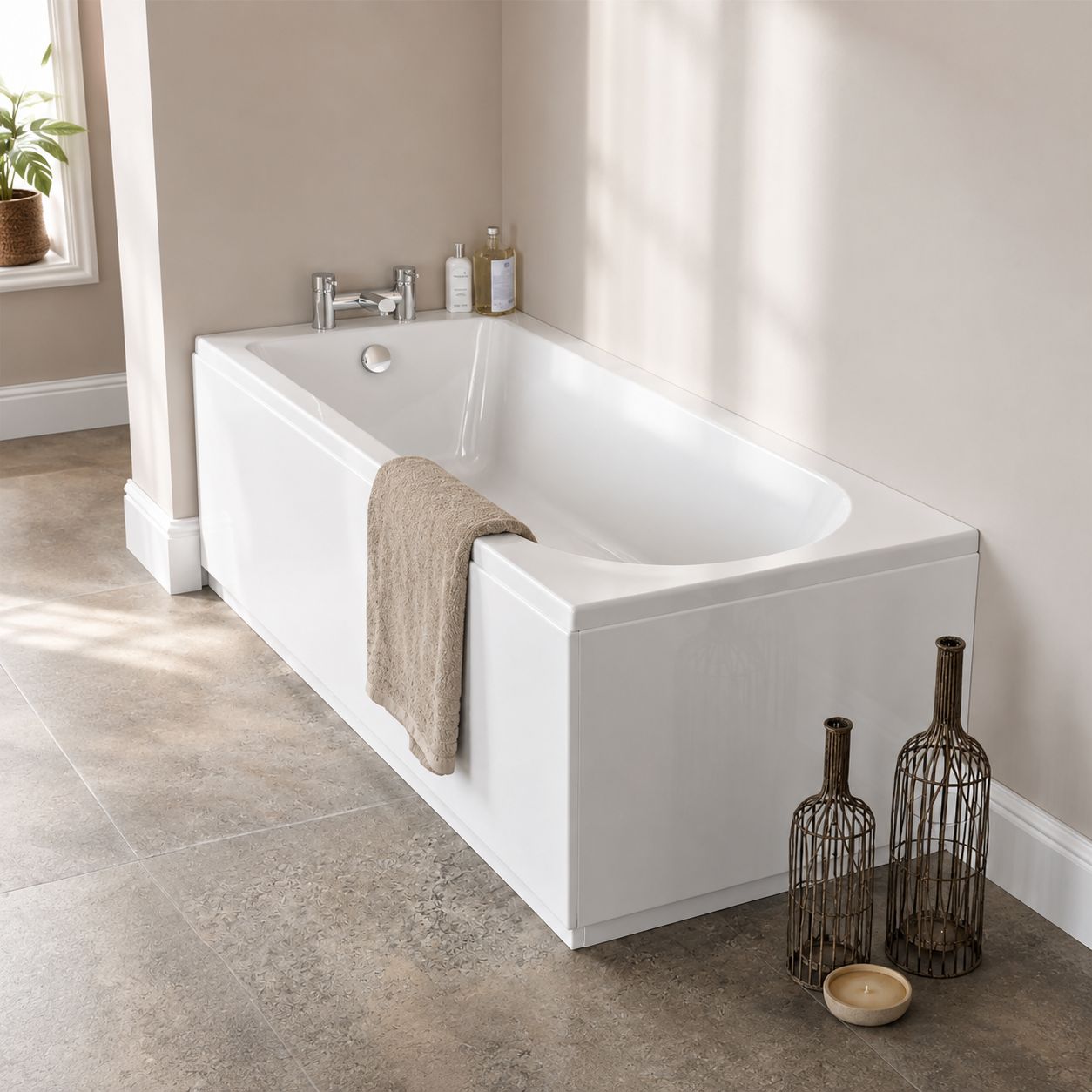 White single-ended acrylic bath photographed in a modern bathroom with neutral tiling — Bathroom Republic UK