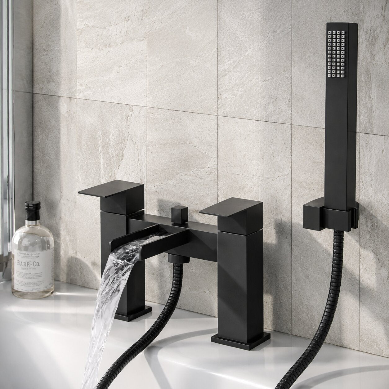 Chrome bath shower mixer tap with shower handset on a white bath — Bathroom Republic UK
