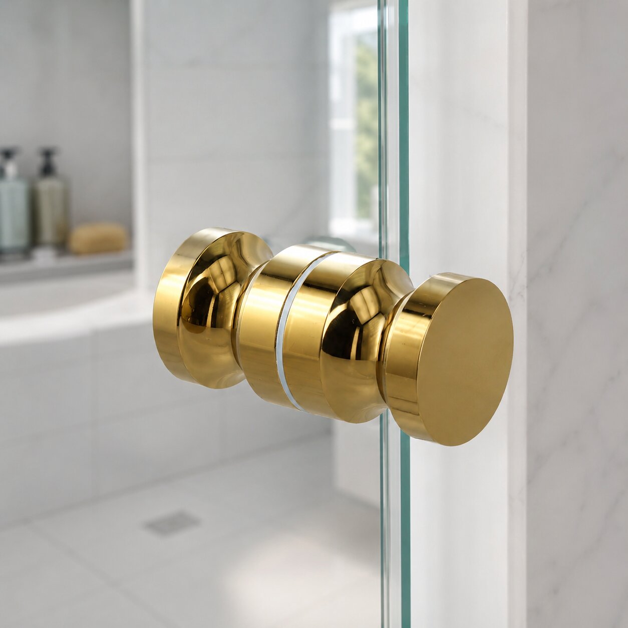Brushed brass round knob handle mounted on a clear glass shower door — Bathroom Republic UK