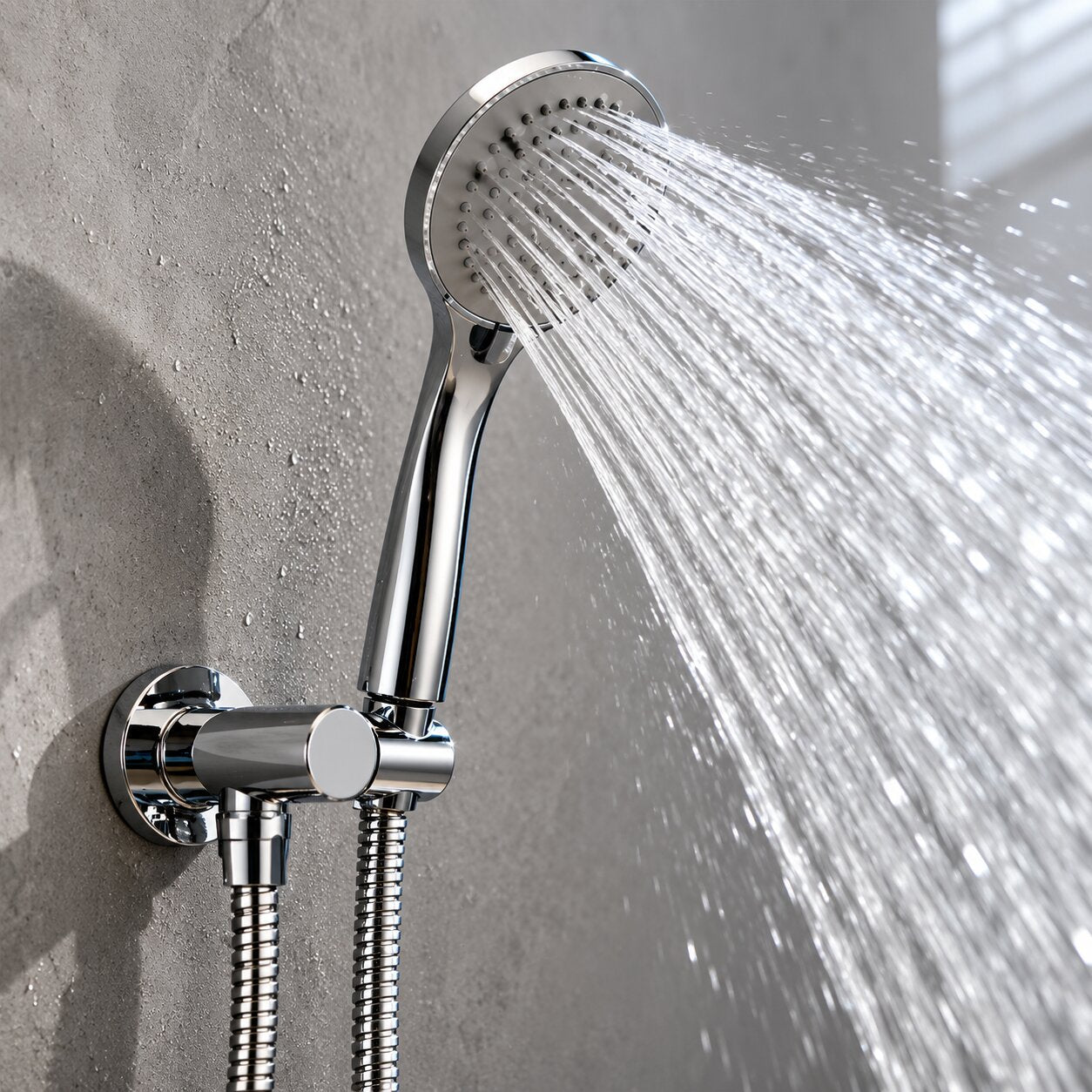Chrome handheld shower head with adjustable wall bracket spraying water in a modern bathroom, featuring a polished finish, flexible shower hose, and high-pressure spray performance.