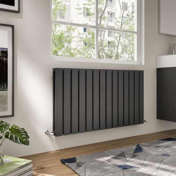 Anthracite horizontal flat panel radiator below window in a modern living room — Bathroom Republic UK