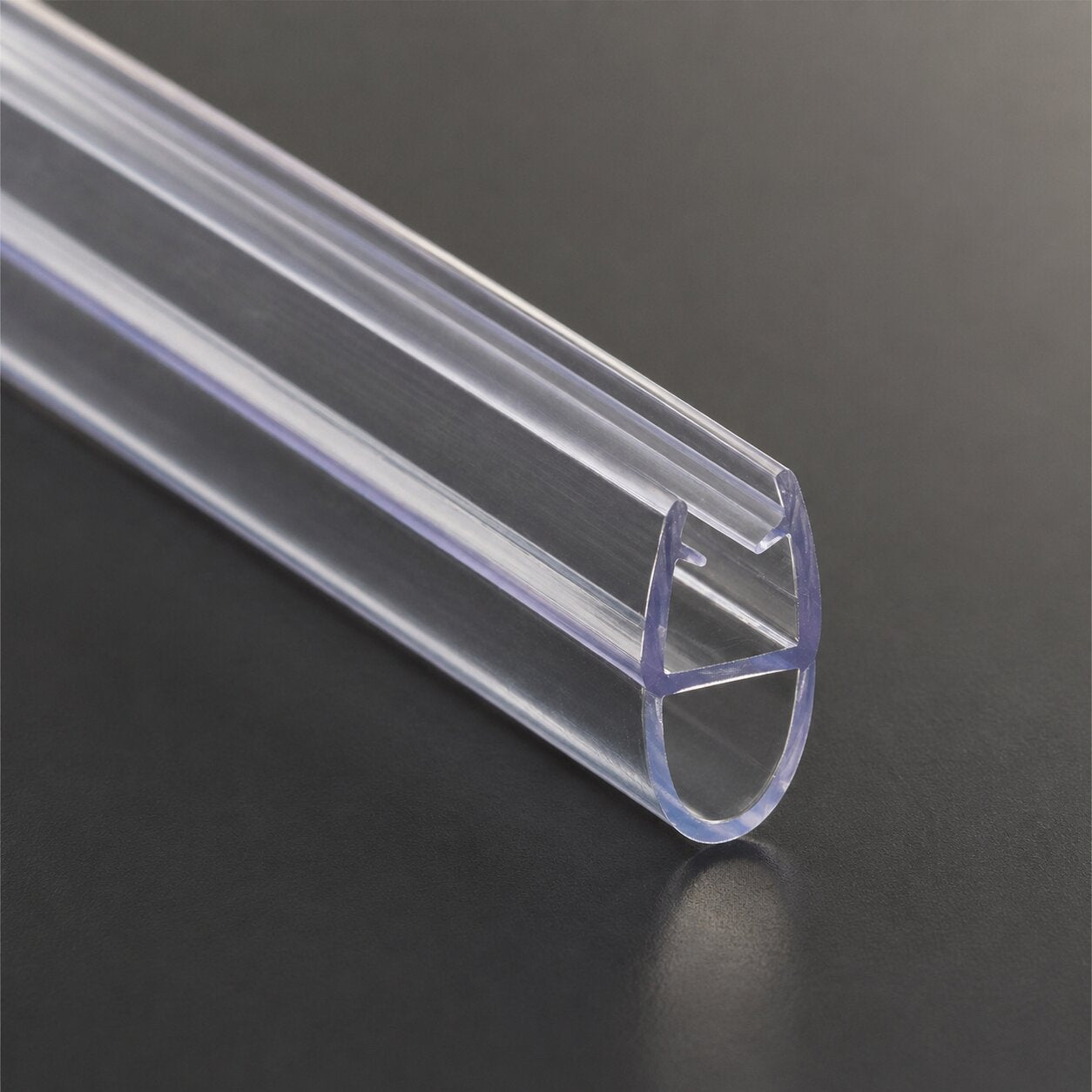 Clear shower door seal strip pressed against a glass enclosure door edge — Bathroom Republic UK