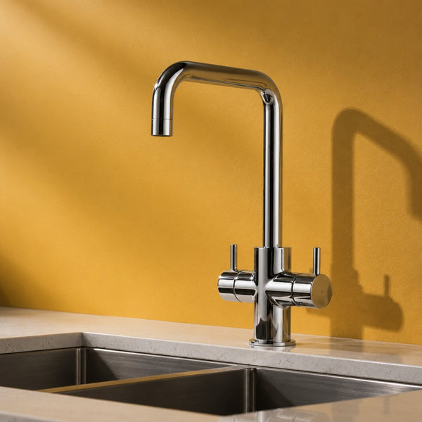 Chrome twin lever kitchen mixer tap on a white kitchen sink — Bathroom Republic UK