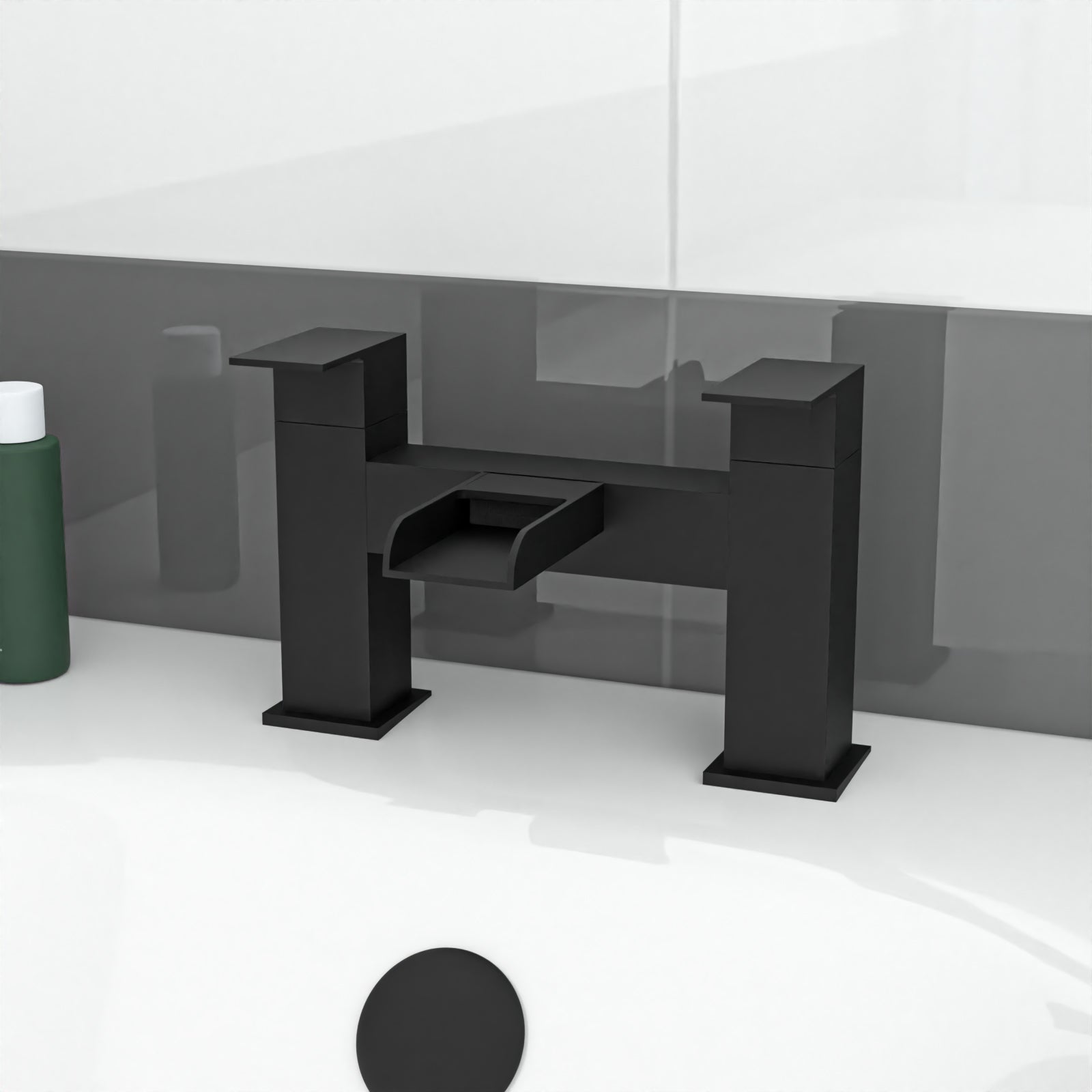 Black bathroom faucet on a white countertop with a gray wall in the background