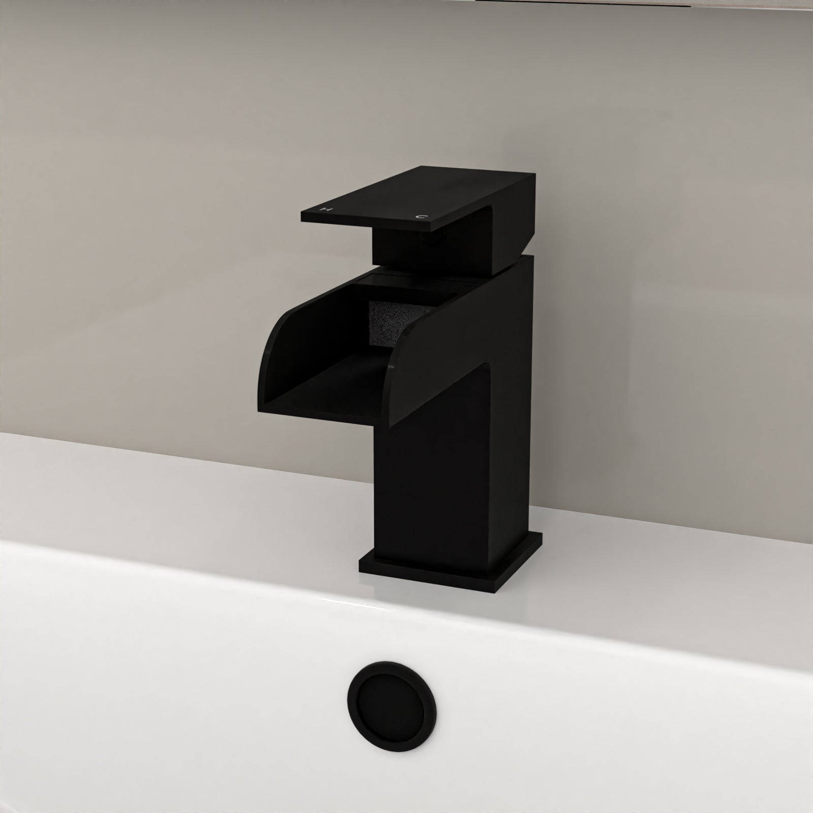 Black bathroom faucet on a white sink with a neutral wall background