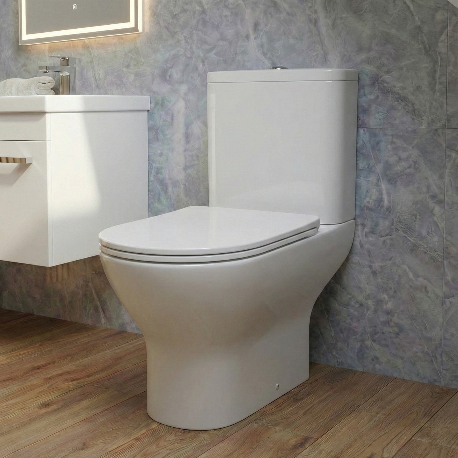 Modern toilet in a bathroom with a sink and decorative wall.