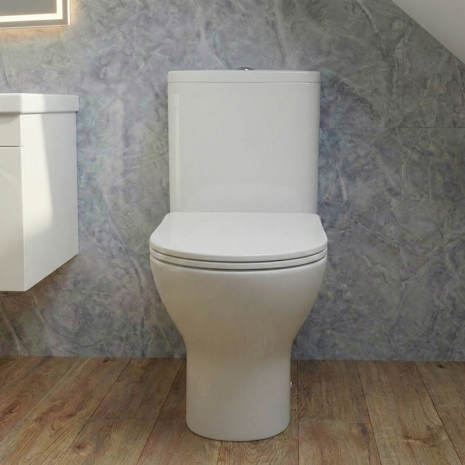 White toilet in a bathroom with a textured gray wall and wooden floor.