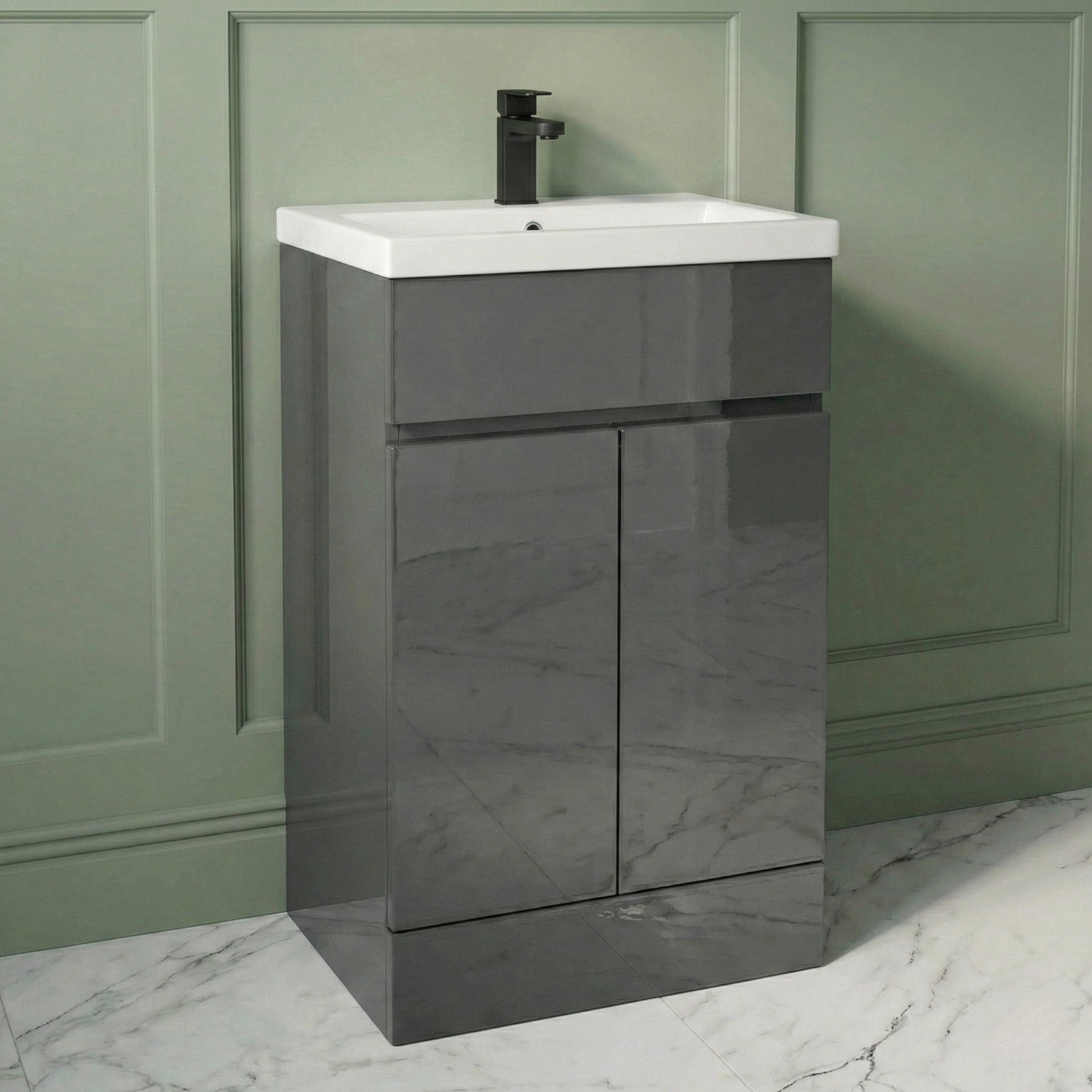 Gray vanity unit with white countertop against a green wall