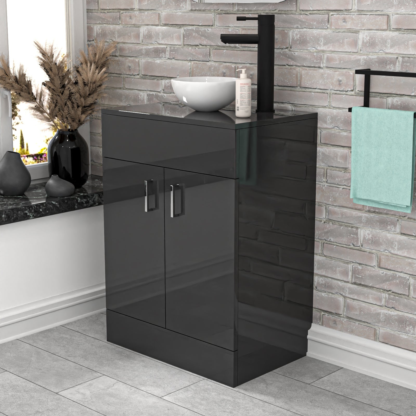 Black vanity unit with sink in a bathroom setting