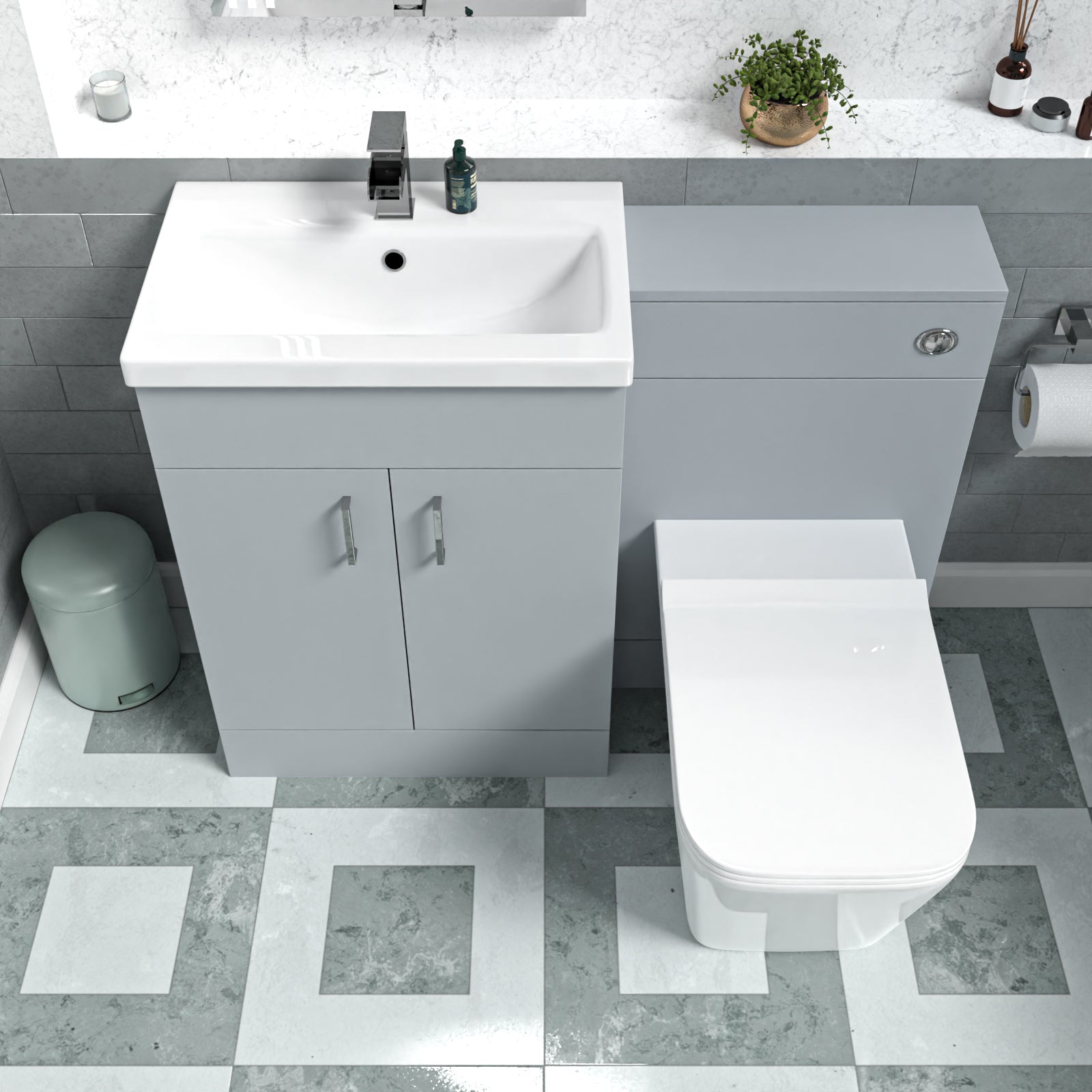 Silver accent setup with trapizium toilet and white basin and metal tap