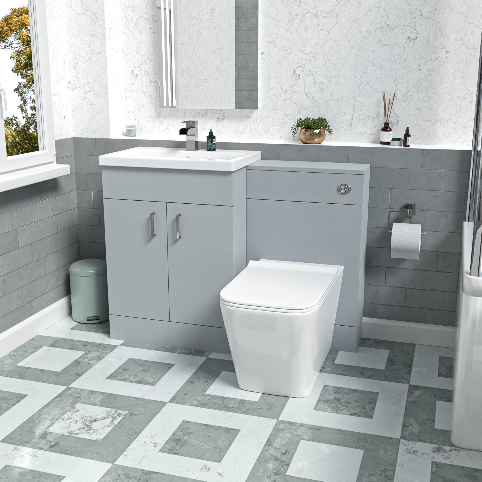 Modern bathroom with gray vanity unit, white toilet, and decorative elements.
