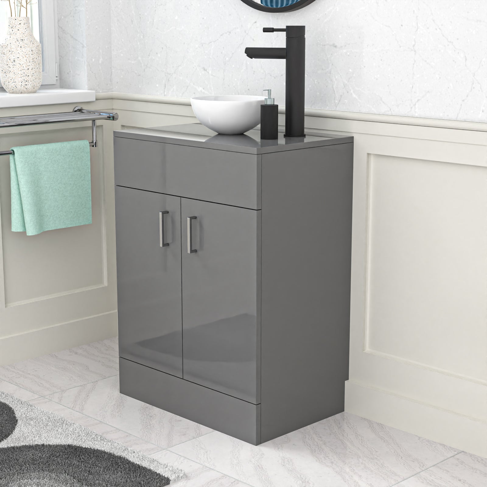 Gray vanity unit with sink and faucet in a bathroom setting