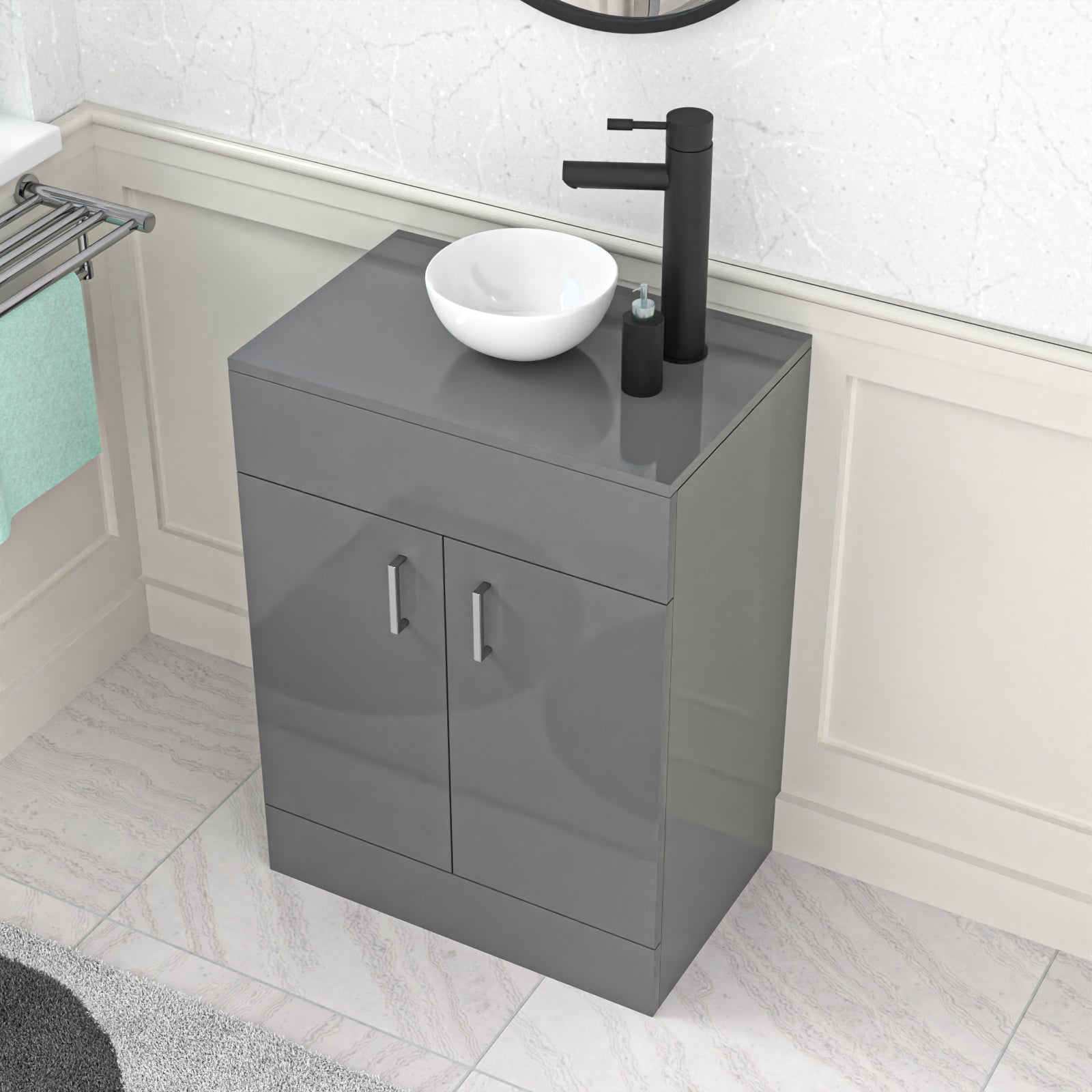 Gray vanity unit with a white bowl sink and black faucet in a bathroom setting.