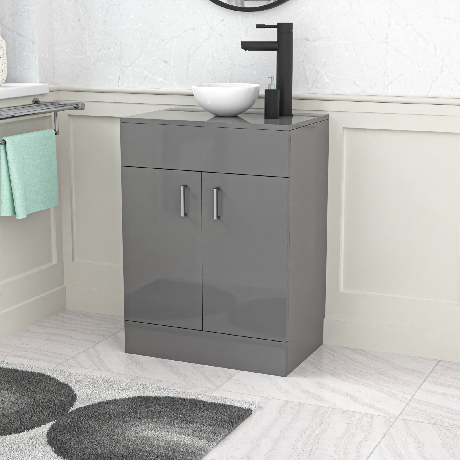 Gray vanity unit with a black faucet and white basin in a bathroom setting.