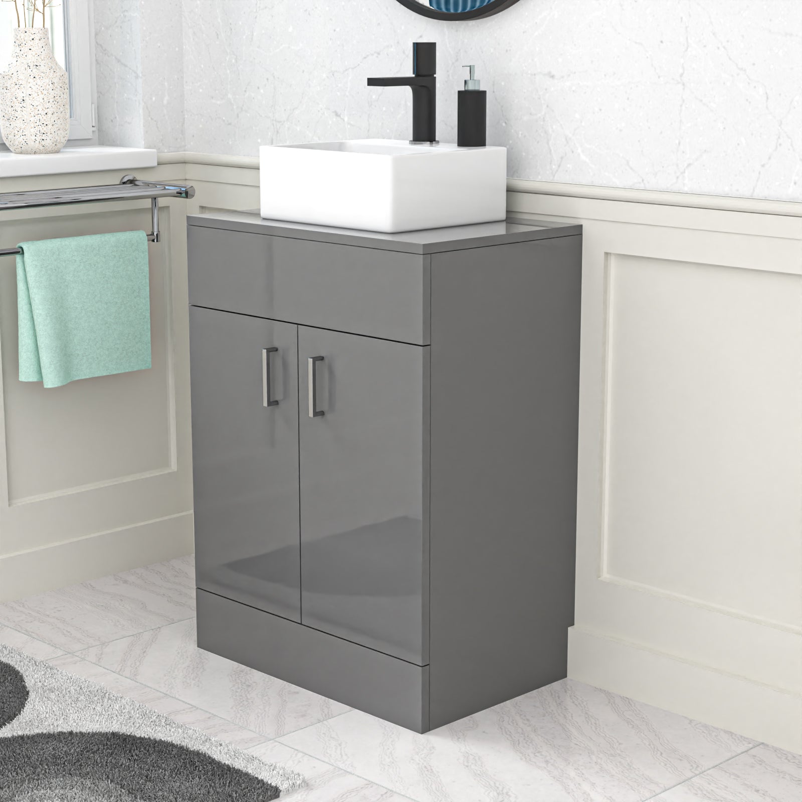 Gray vanity unit with white basin and sink in a bathroom setting
