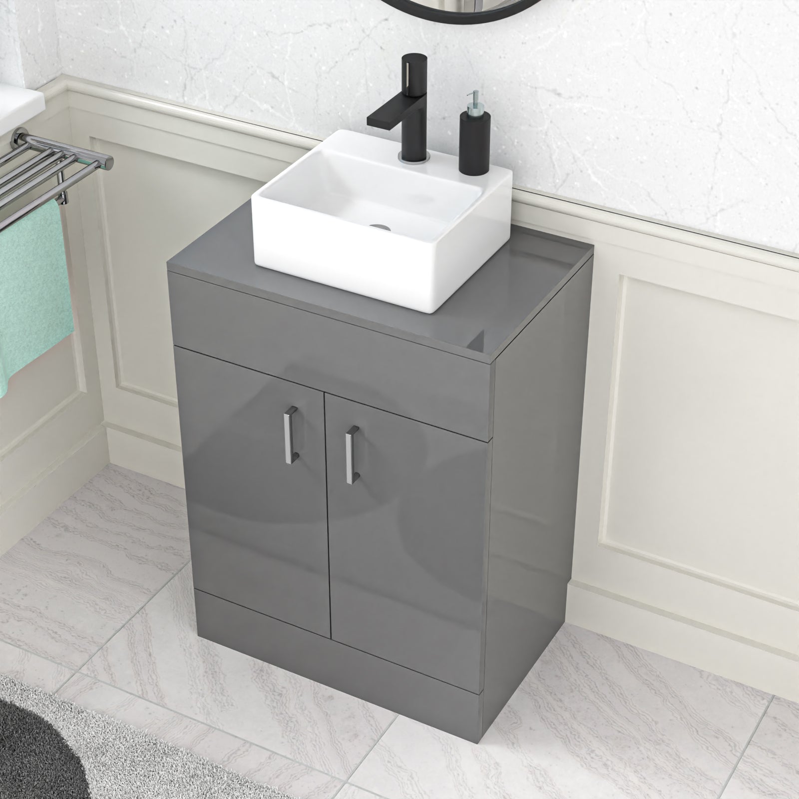 Gray vanity unit with white sink and black faucet in a bathroom setting.