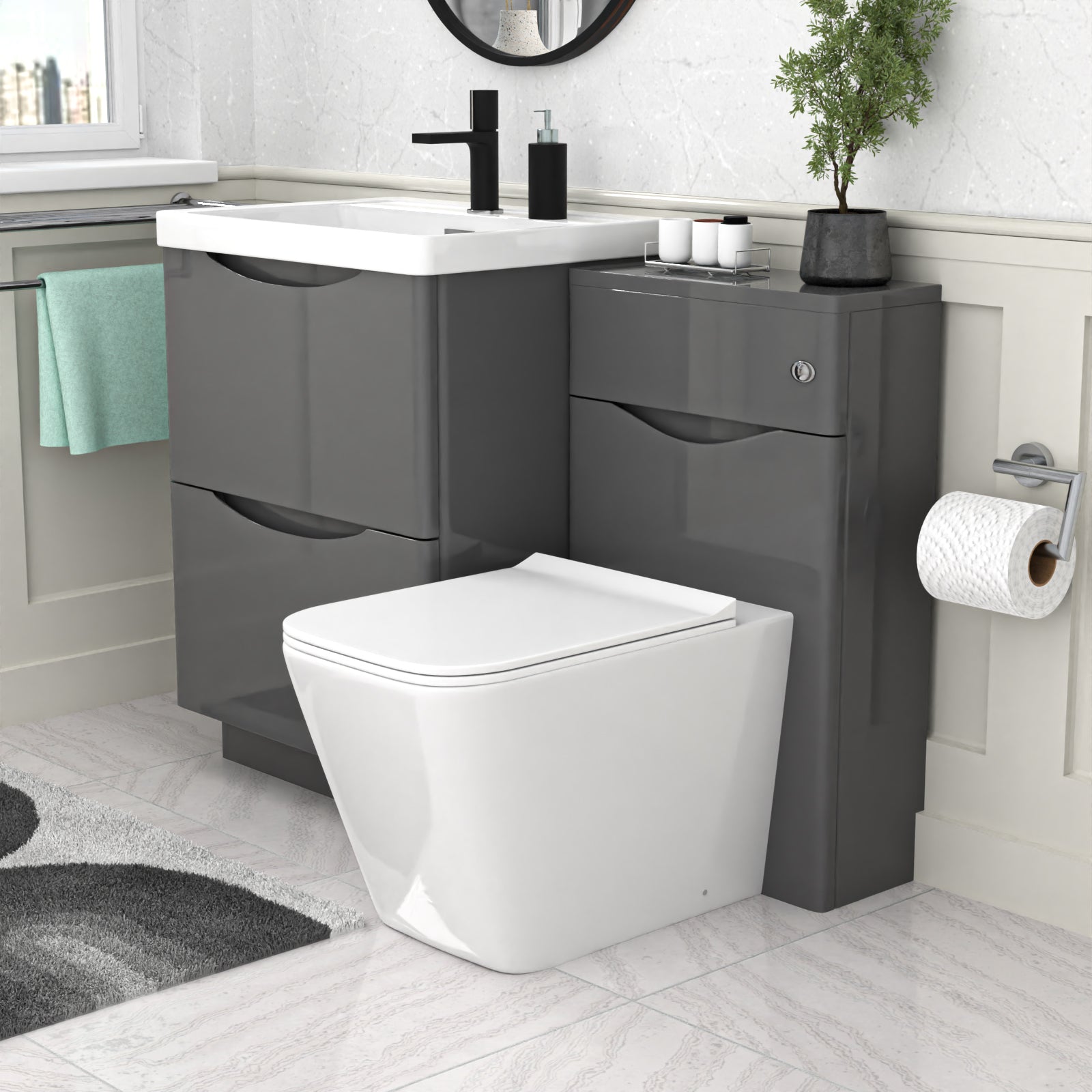 Bathroom setup with gray vanity unit, white toilet, and sink.