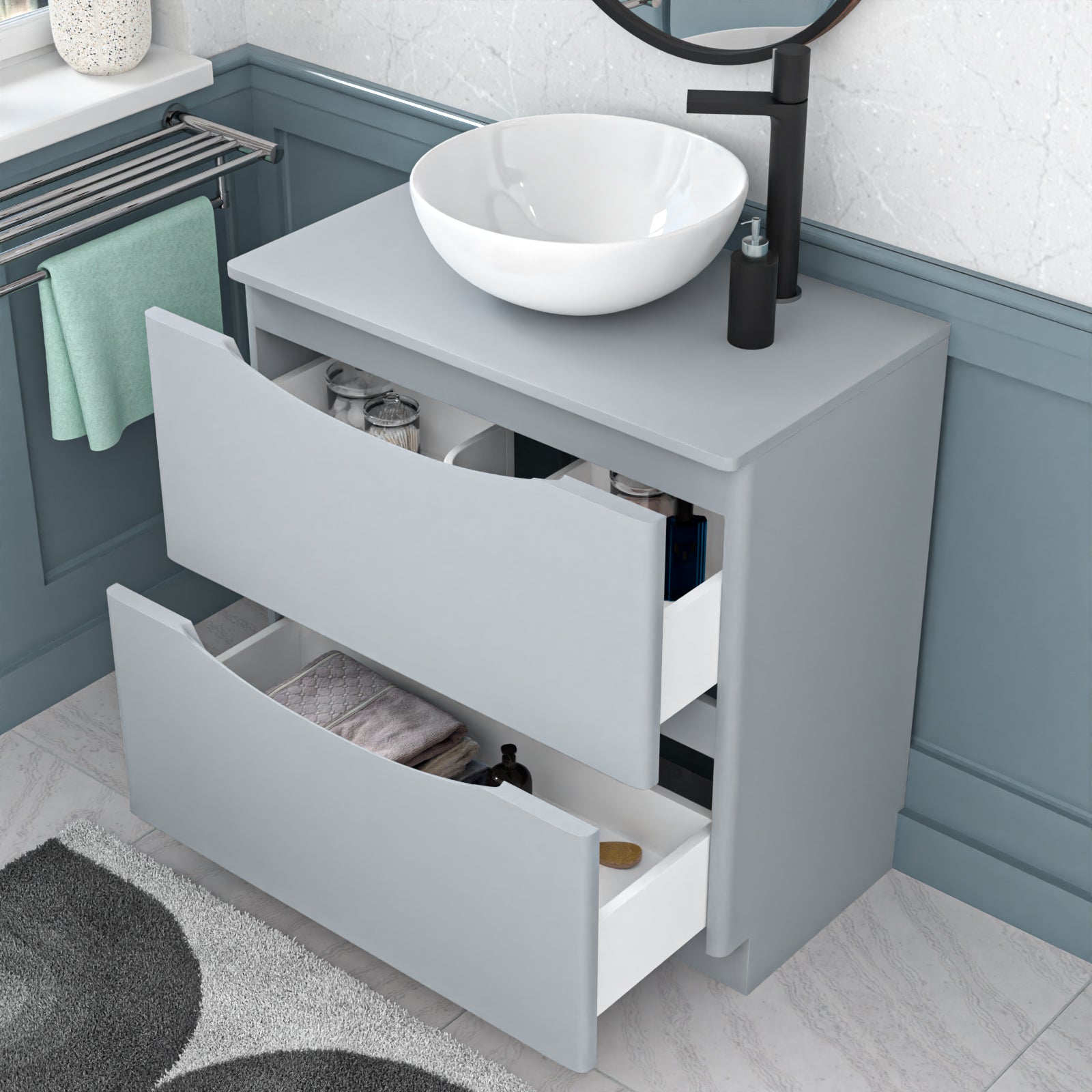 Gray vanity with white sink and open drawers in a bathroom setting