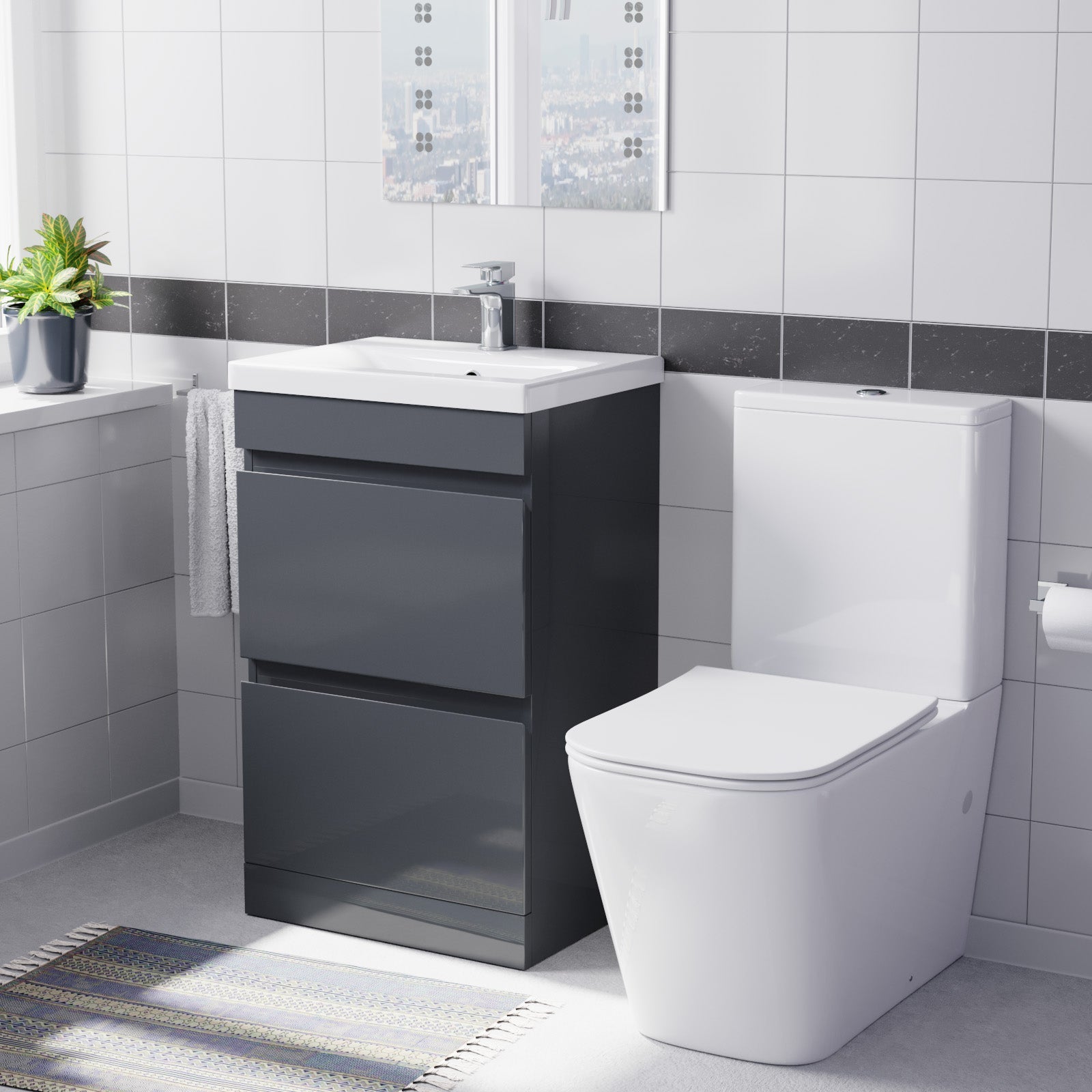 Bathroom with gray vanity unit, white toilet, and sink.