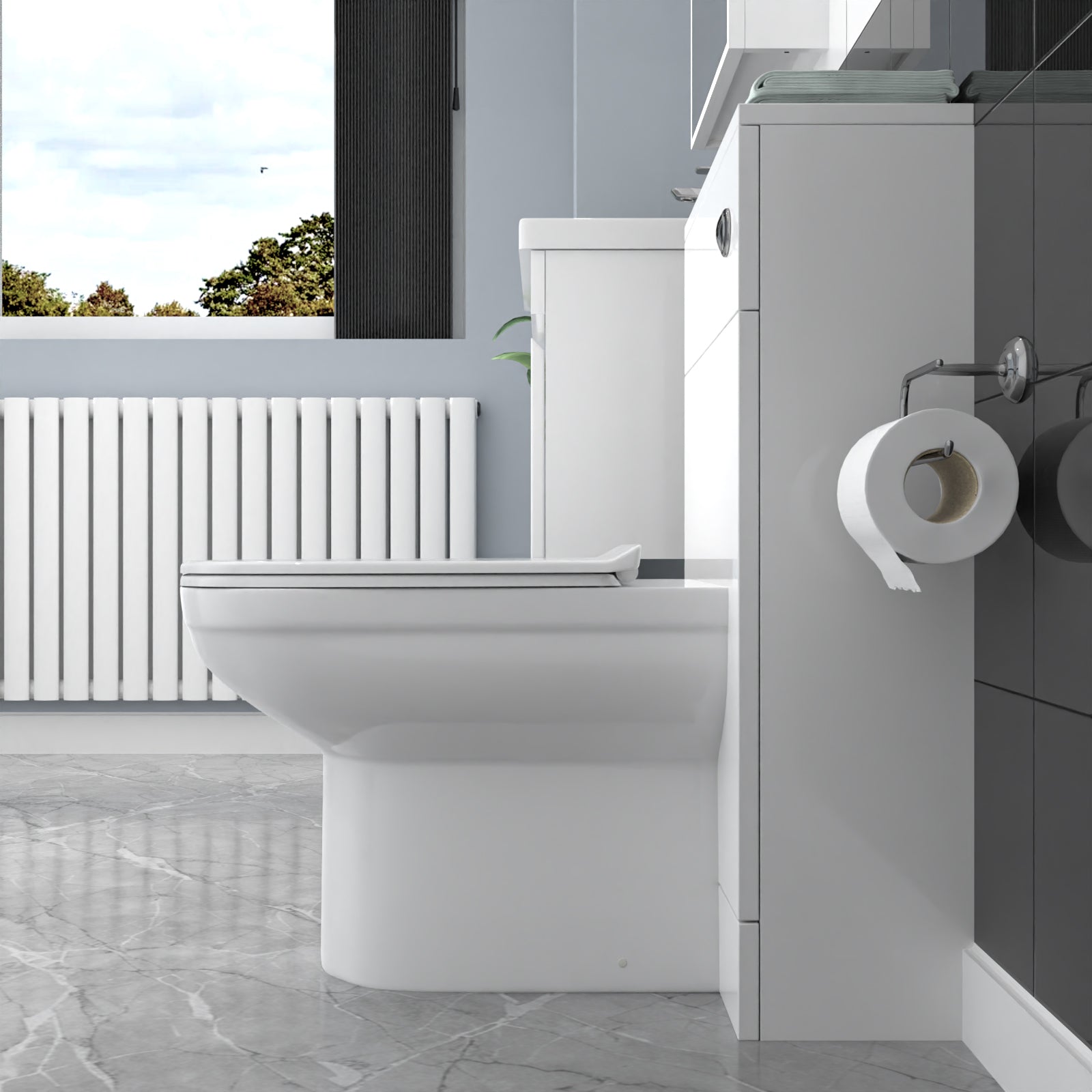 Modern bathroom with a toilet and toilet paper holder.