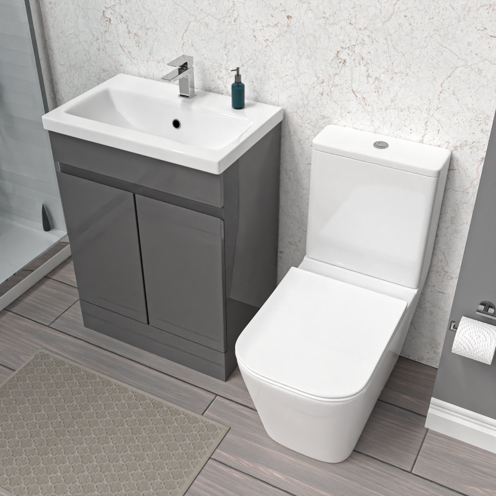 Bathroom setup with a gray vanity unit, white sink, and toilet.