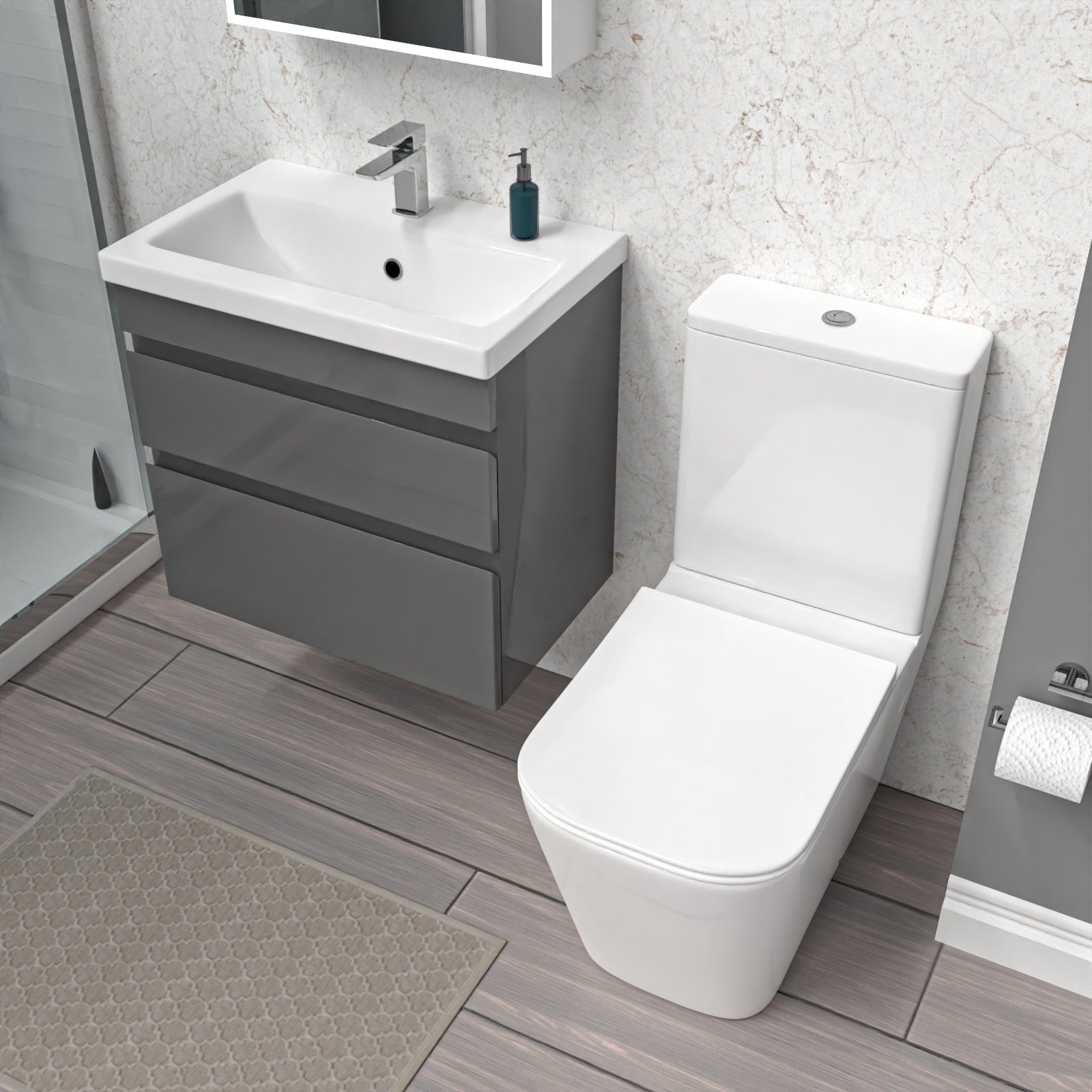 Bathroom with gray wall hung vanity, white toilet, and sink.