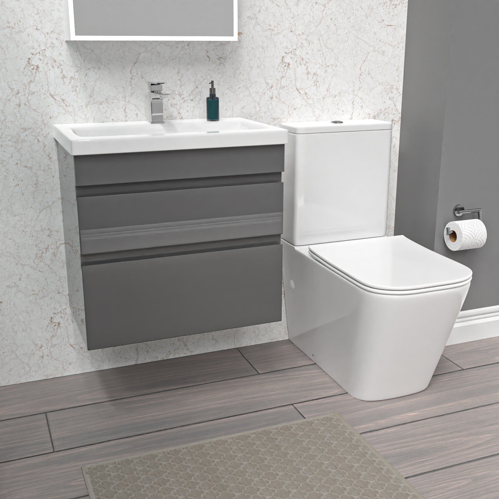 Bathroom setup with gray vanity unit, white toilet, and sink.