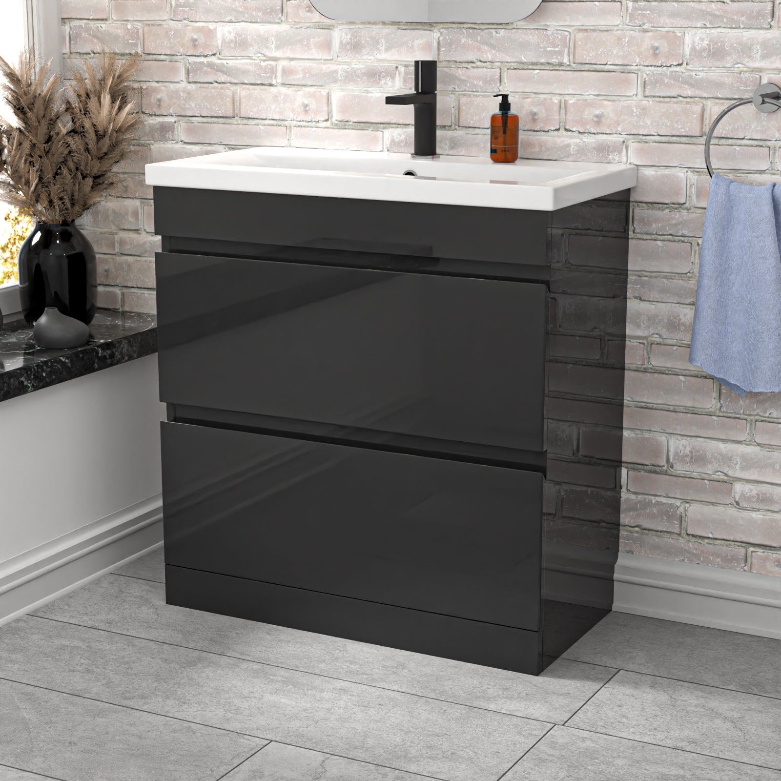 Black vanity unit with white countertop in a bathroom setting