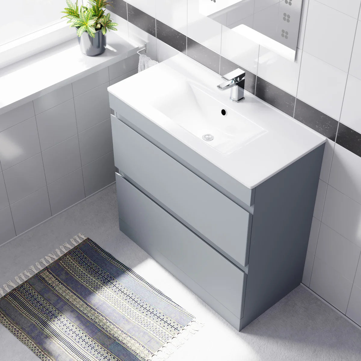 Bathroom with a gray vanity unit, white sink, and decorative rug.