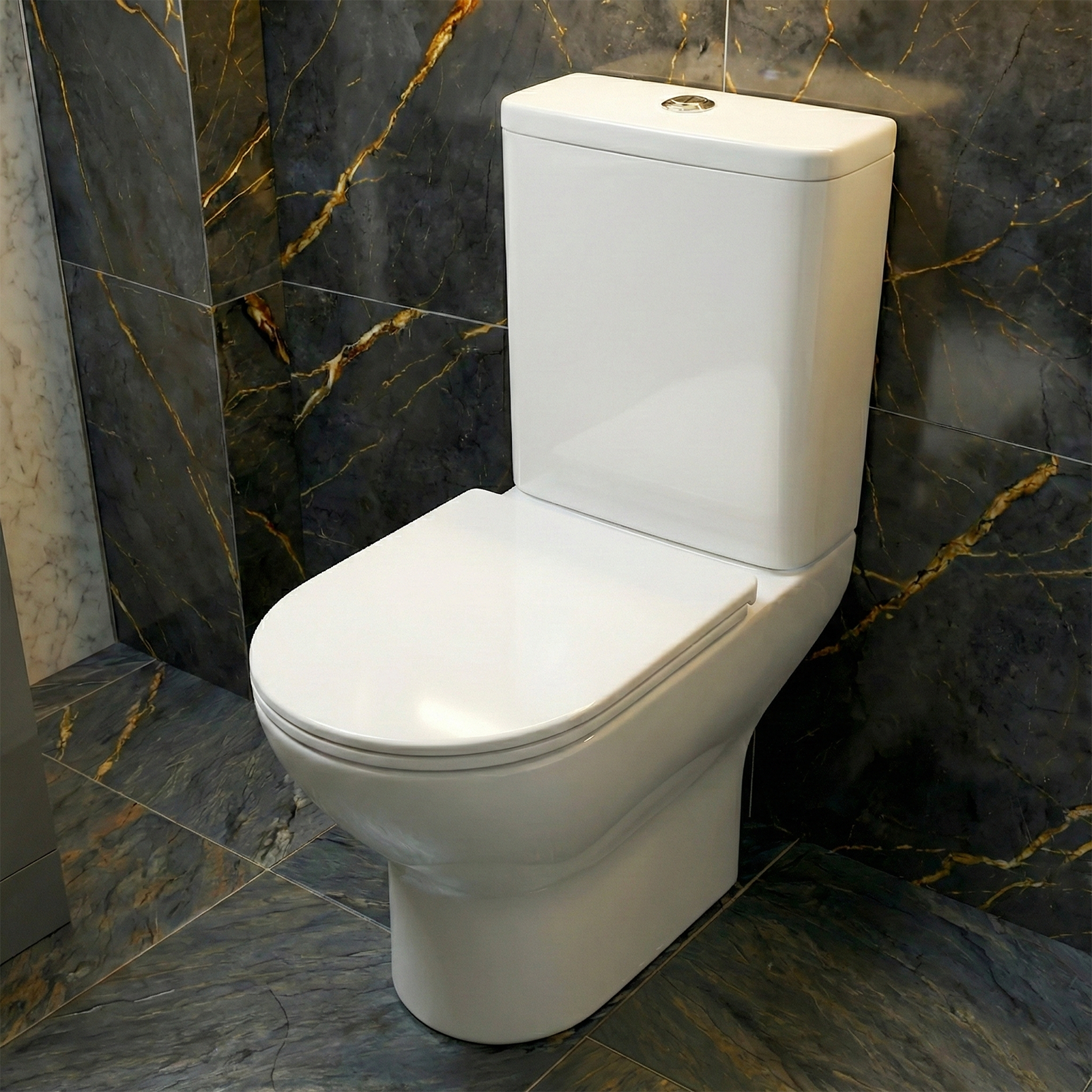 Rimless Close Coupled Toilet installed on a marble tiled background