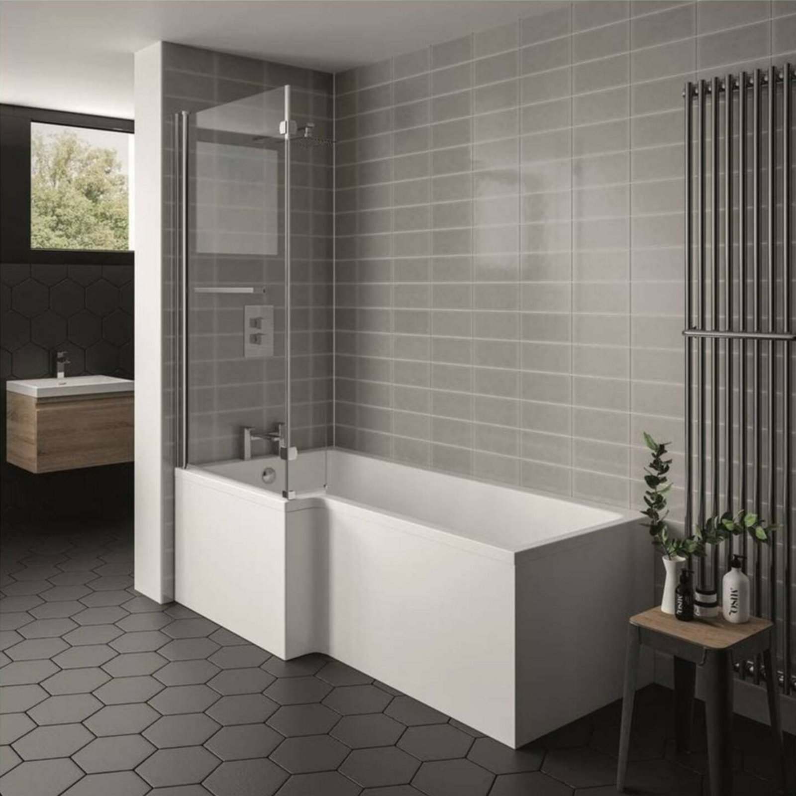 Modern bathroom with a white bathtub, glass shower screen, and hexagonal floor tiles.