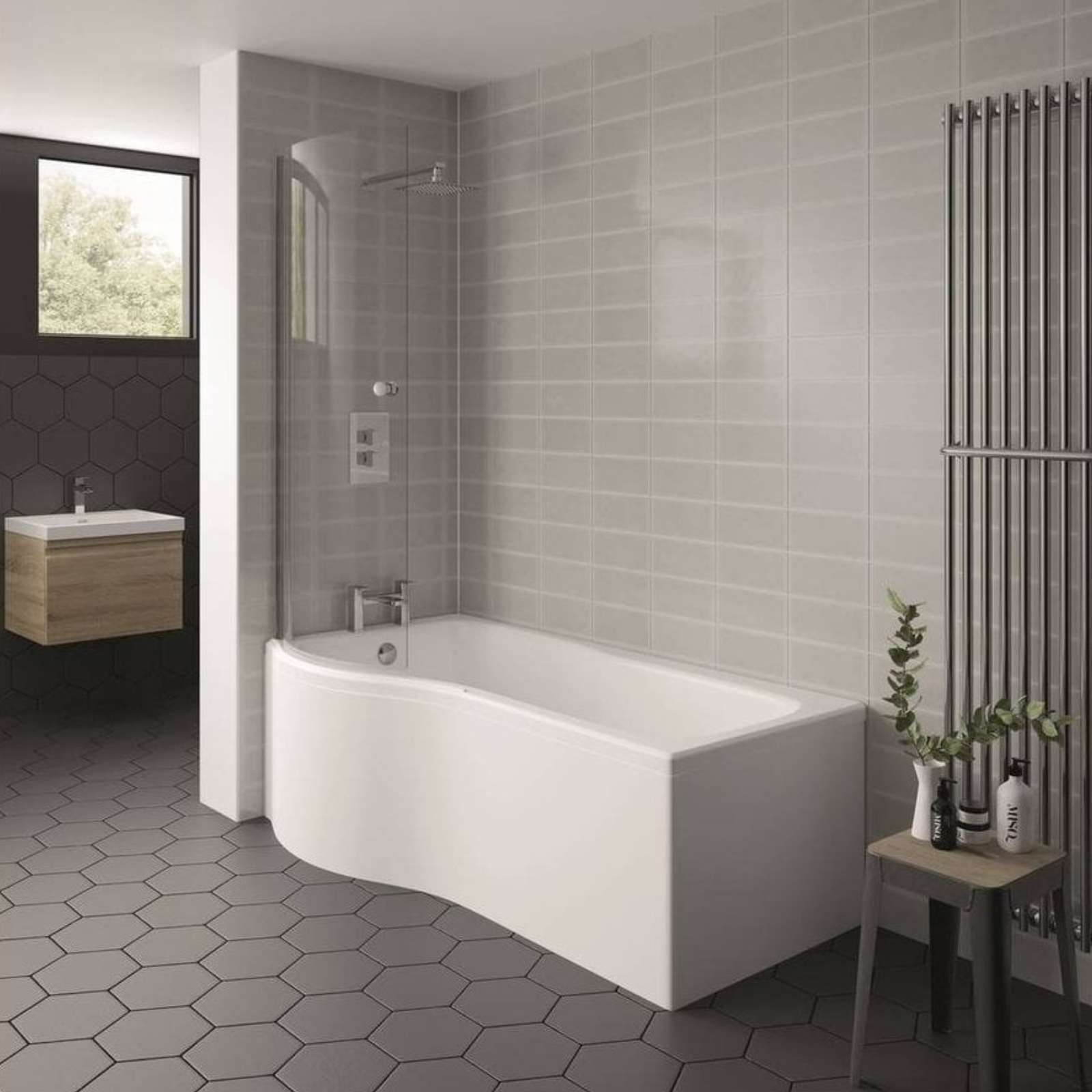 Super Modern bathroom with a white obliqued panel freestanding bathtub, gray tiled walls, and hexagonal floor tiles.