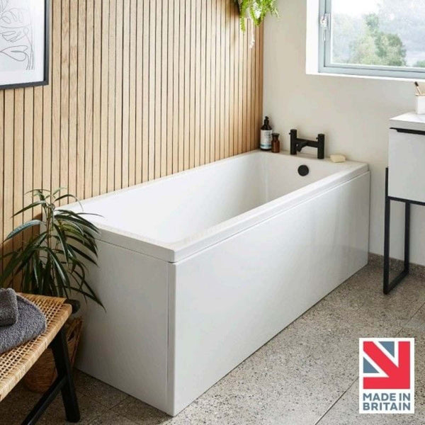 White freestanding bathtub in a modern bathroom with a made in Britain logo.