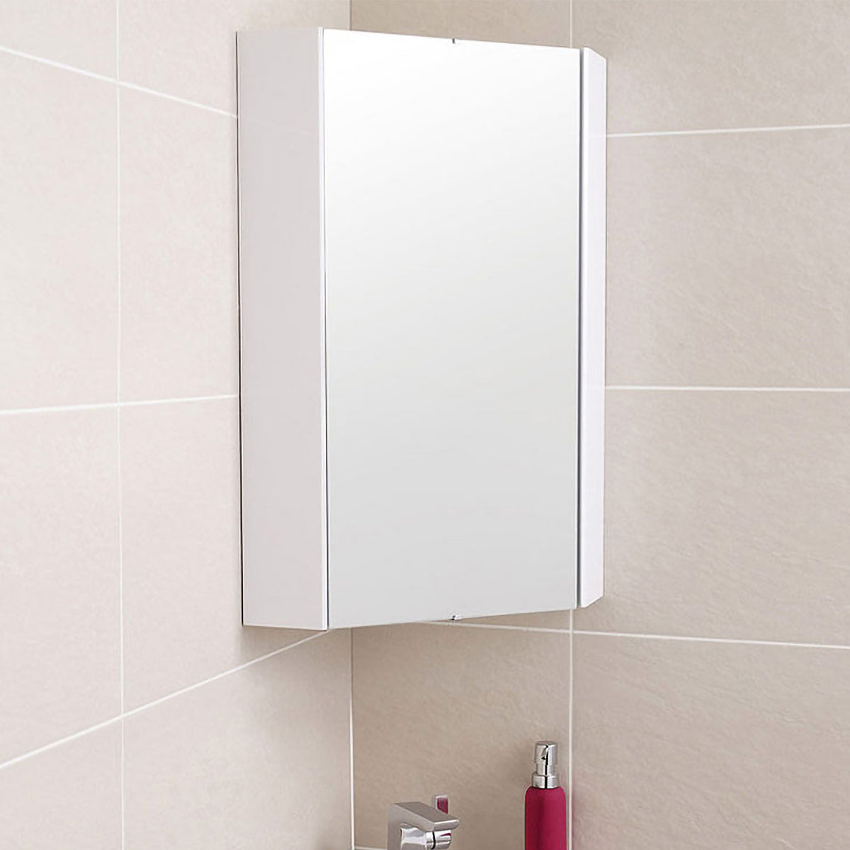 White bathroom cabinet with mirror on a tiled wall