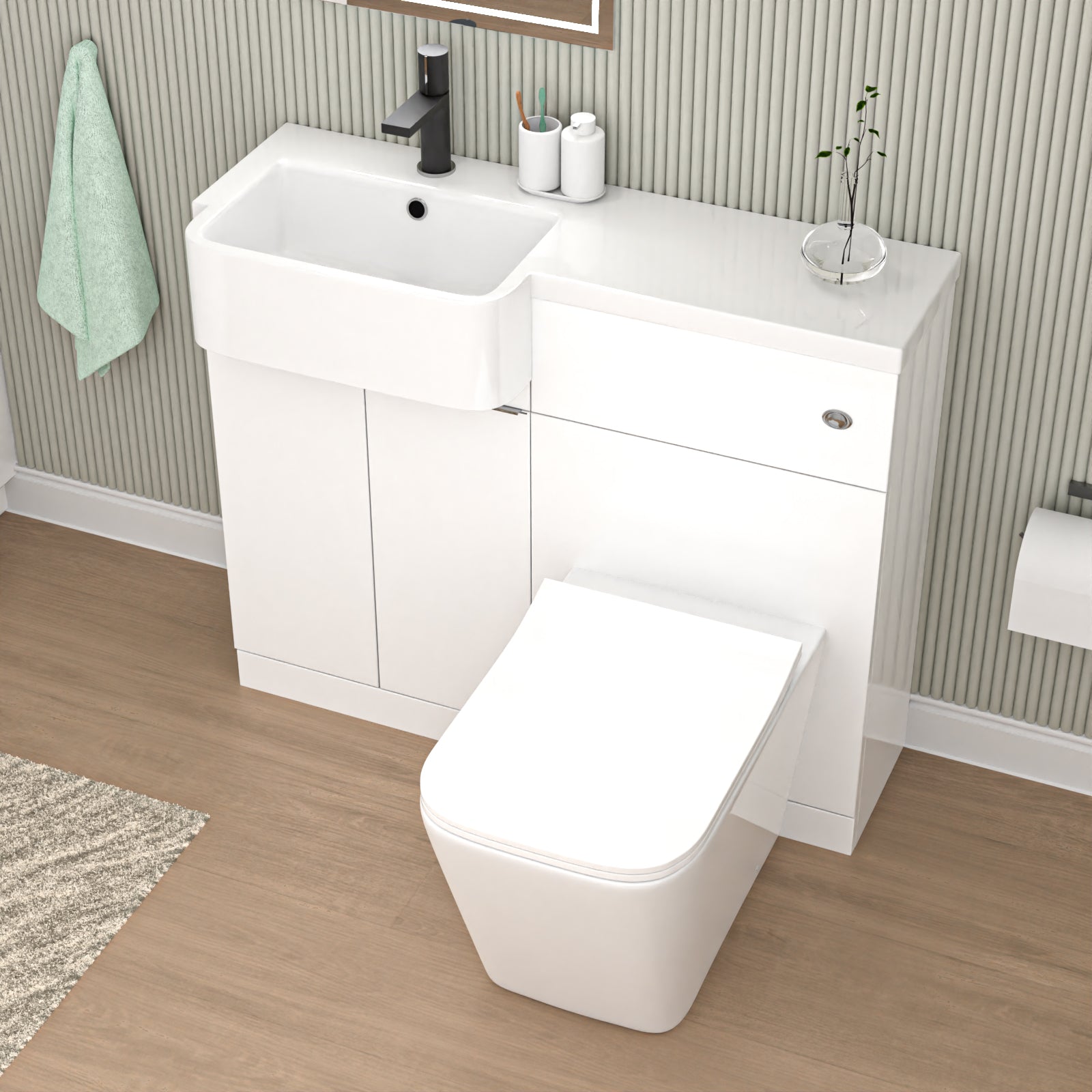 Bathroom setup with white vanity unit, sink, and toilet against a striped wall.