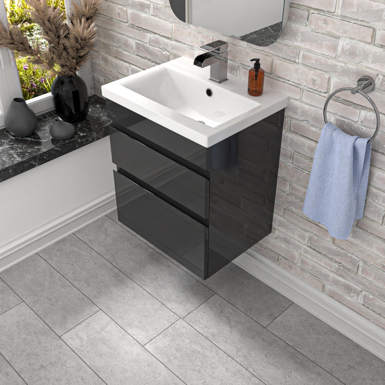 Bathroom with black vanity unit, white sink, and gray tiled floor.