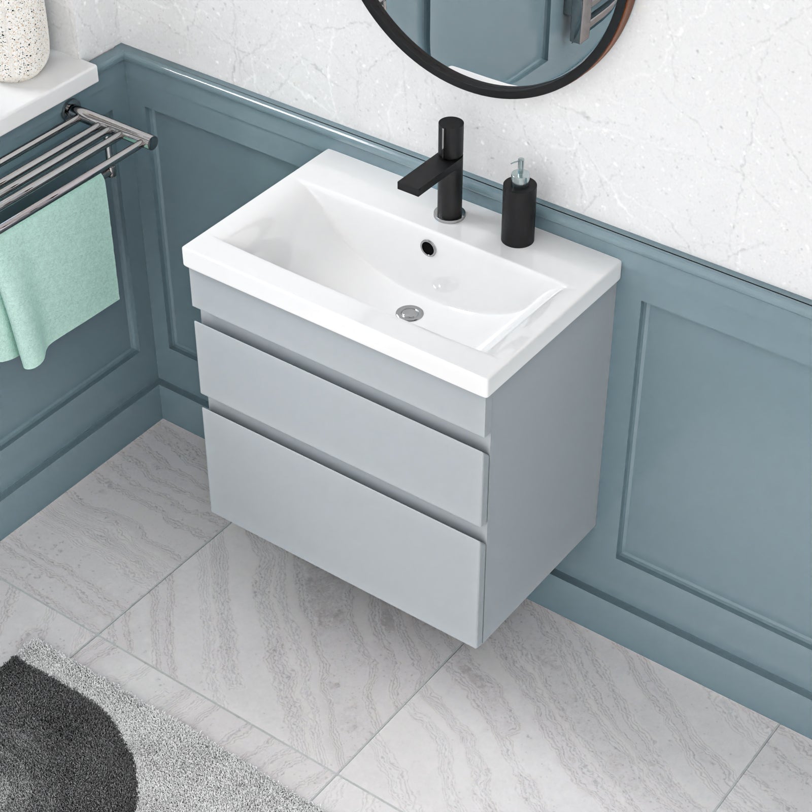 Bathroom vanity with white sink and gray cabinet against a blue wall.