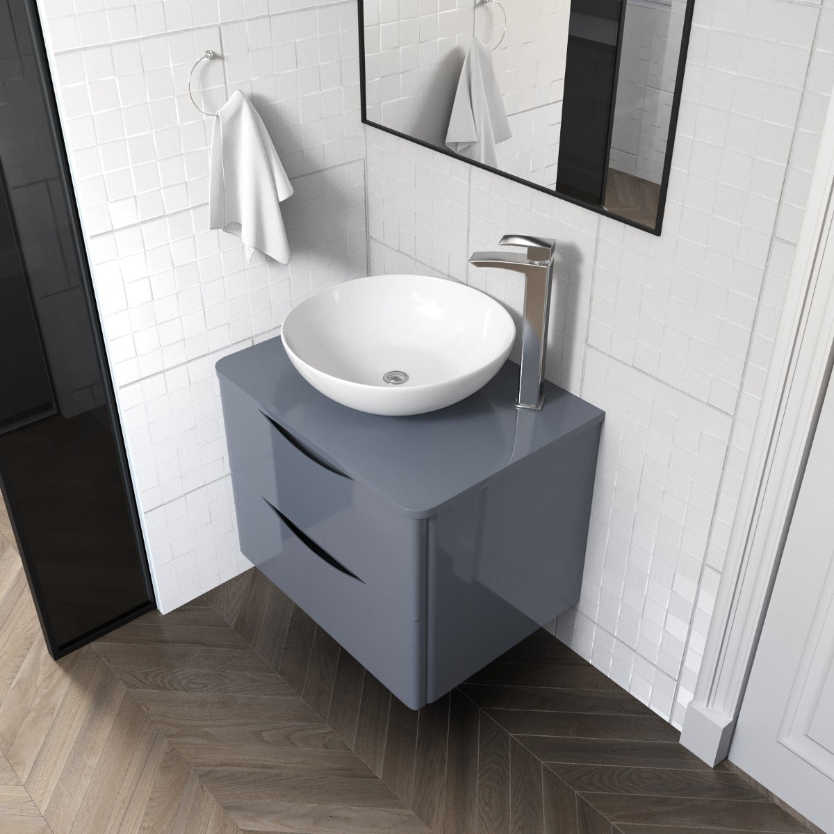 Modern bathroom with a gray vanity unit, white sink, and mirror.