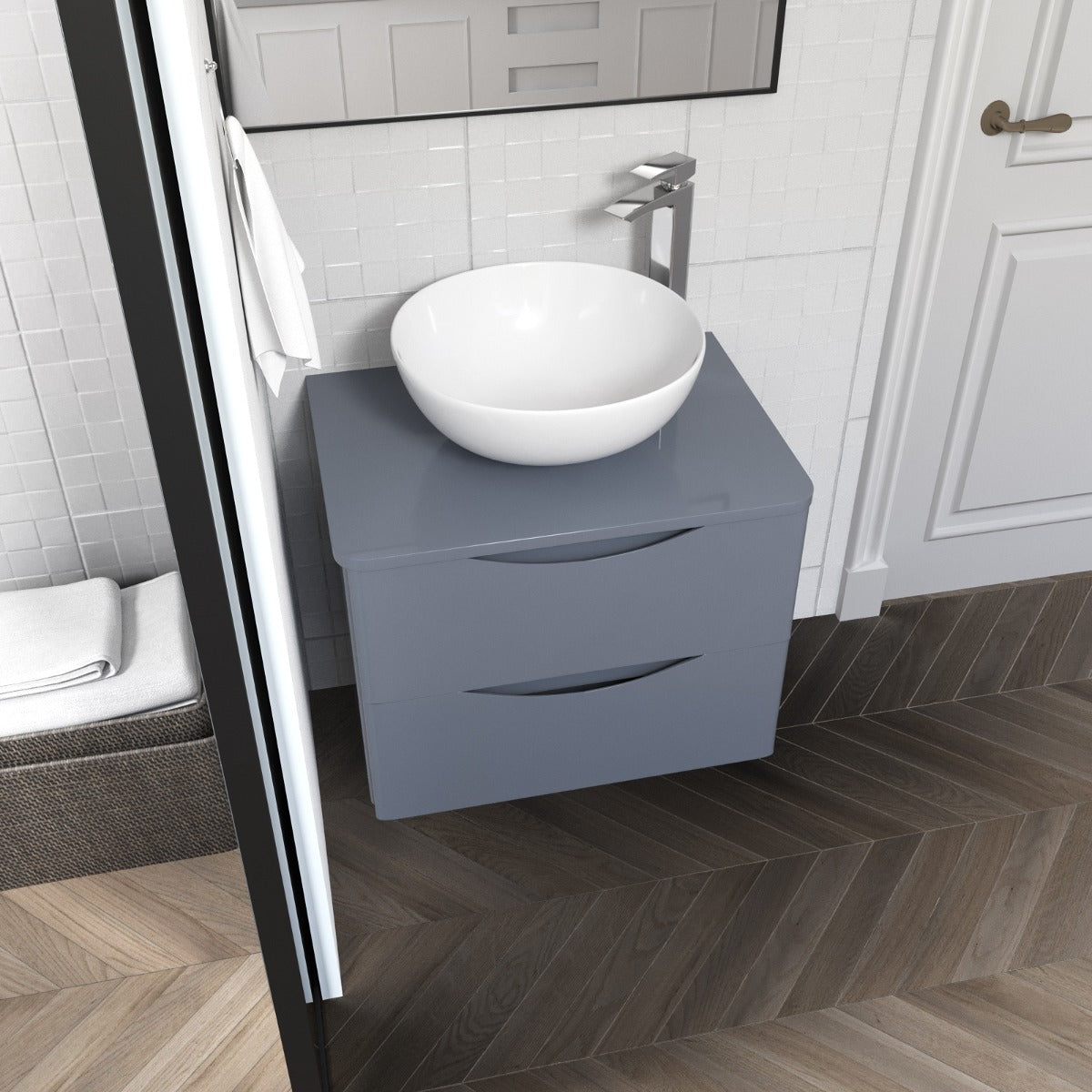 Bathroom vanity with a white sink and gray cabinet.