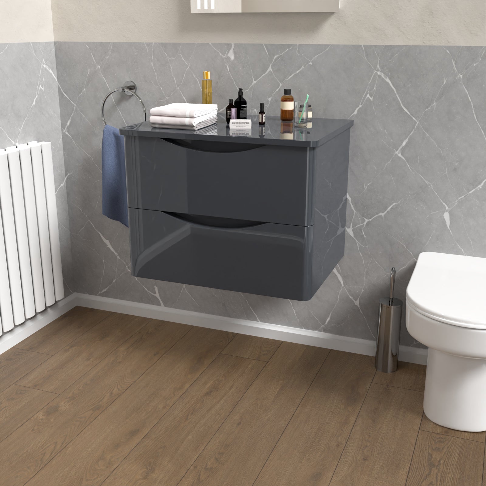 Bathroom with a gray wall-mounted cabinet, white toilet, and wooden floor.