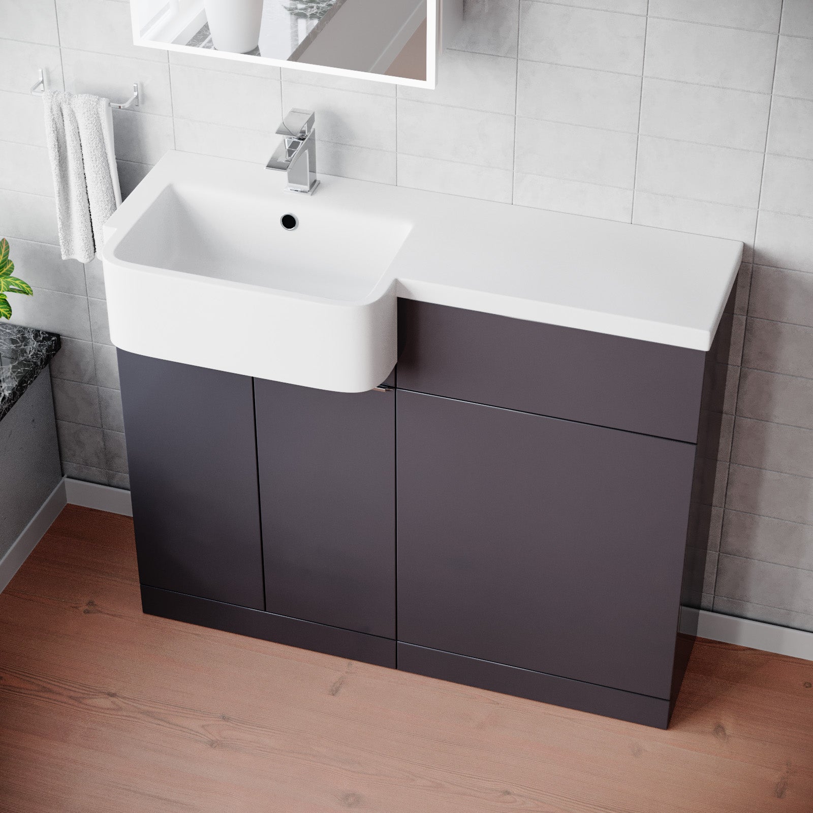 Bathroom vanity with white sink and dark gray cabinets in a tiled bathroom.
