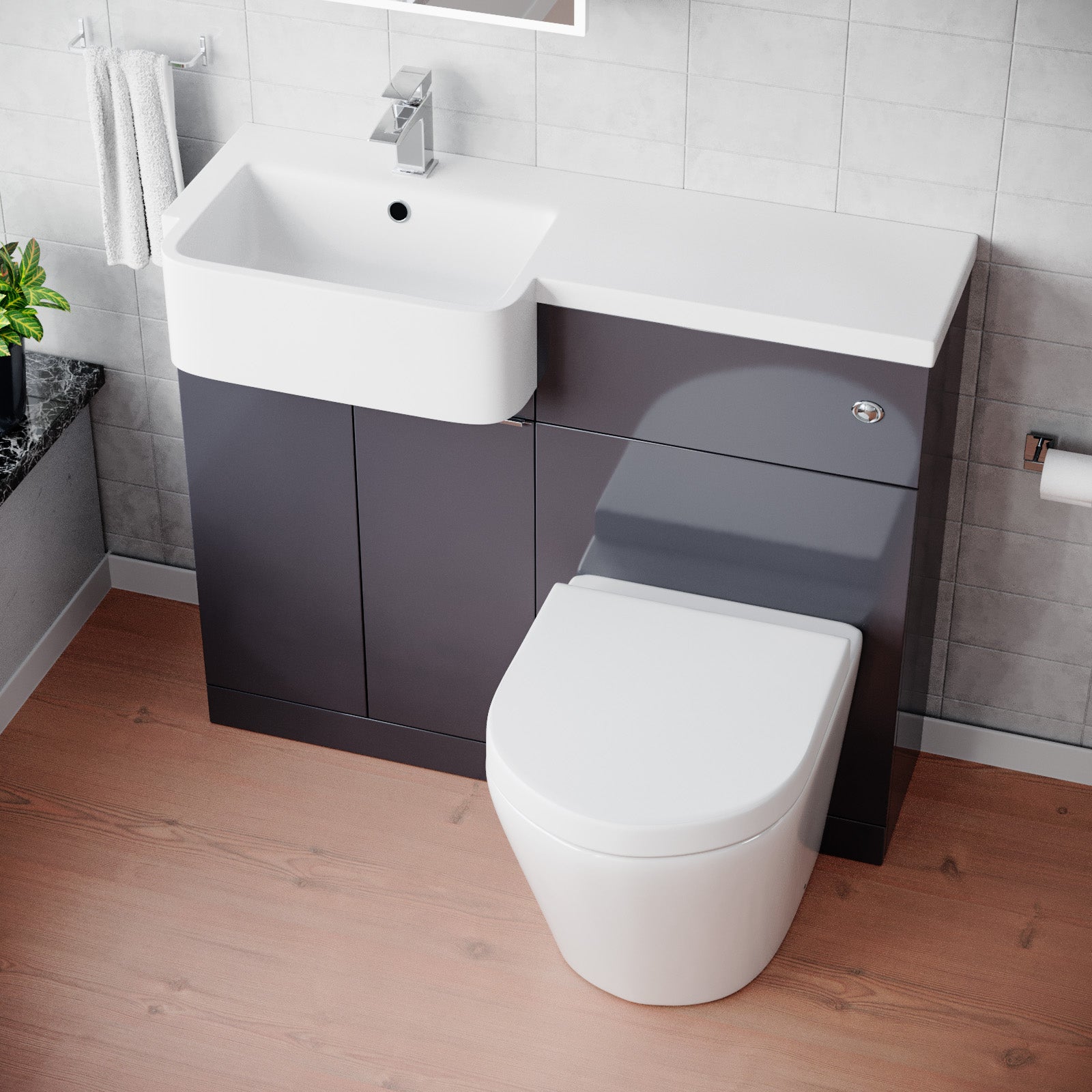 Bathroom setup with a white toilet, dark gray vanity unit, and sink.